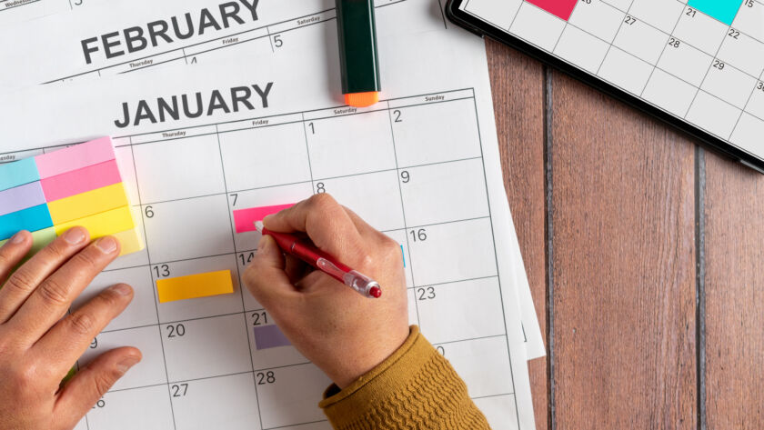 Real estate social media management calendar with color coded sticky notes